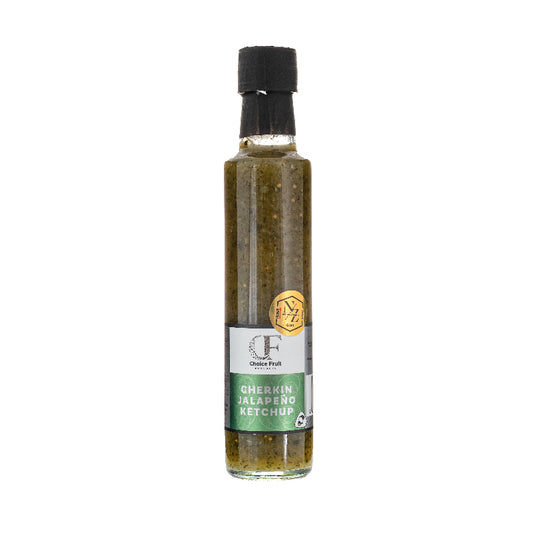 Bottle of Gherkin Jalapeno Ketchup with a black cap on a white background