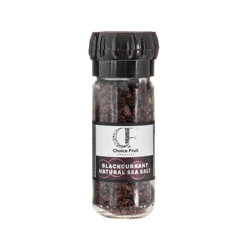 Jar of blackcurrant natural sea salt with a black lid on a white background