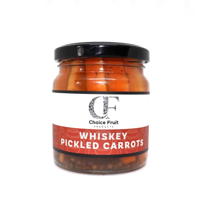 Jar of whiskey pickled carrots with a red label on a white background